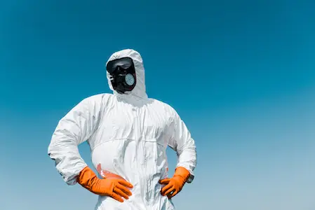 Man in a billbug pest control suit